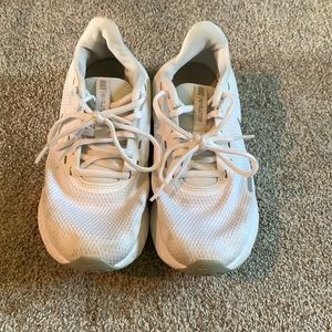 White Nike running shoes